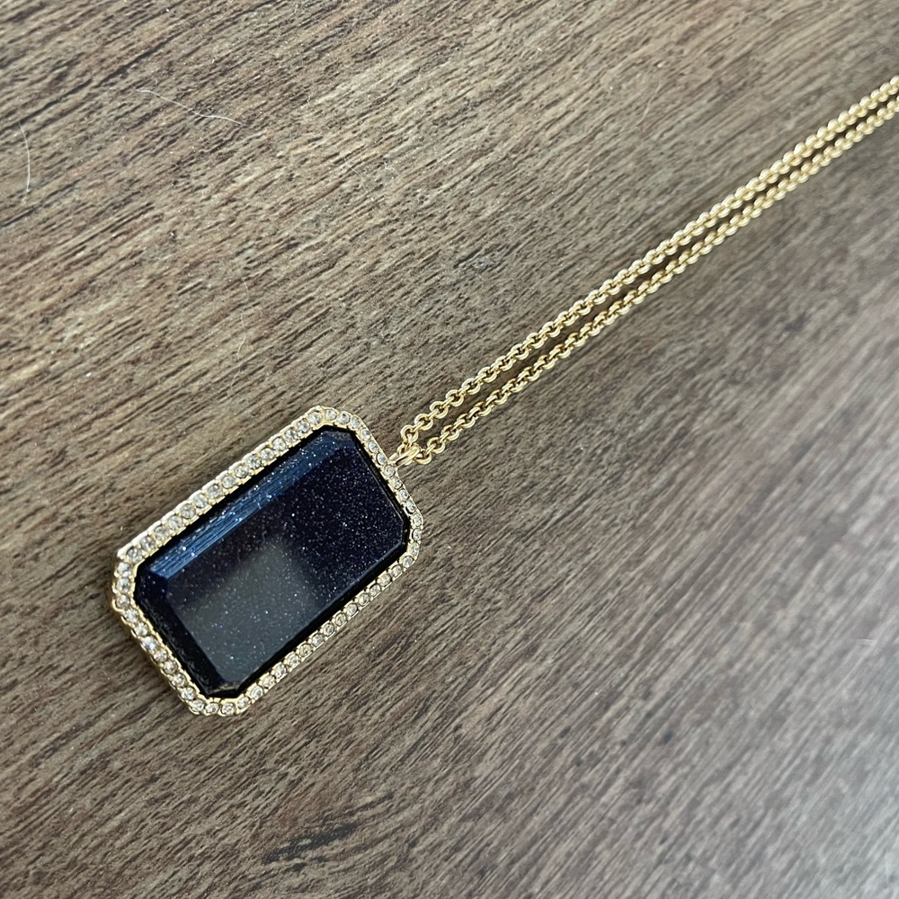 Kate spade New York long gold and dk navy blue glitter pendant. Never worn